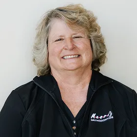 Masri Orthodontics team member Dolly smiling, dedicated to creating beautiful smiles in Livonia, MI.
